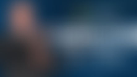 Bald man in suit points beside text Epic Charter Schools Parent Zoom Meeting with Dr. Ross on blue starry background.